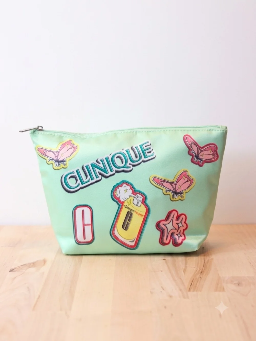 Clinique Mint Green Cosmetic Pouch with Pink and Yellow Accents